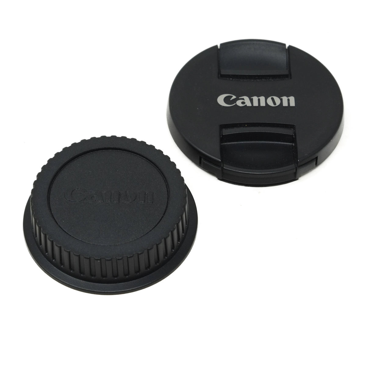 Canon camera lens cap and body cap on a white background
