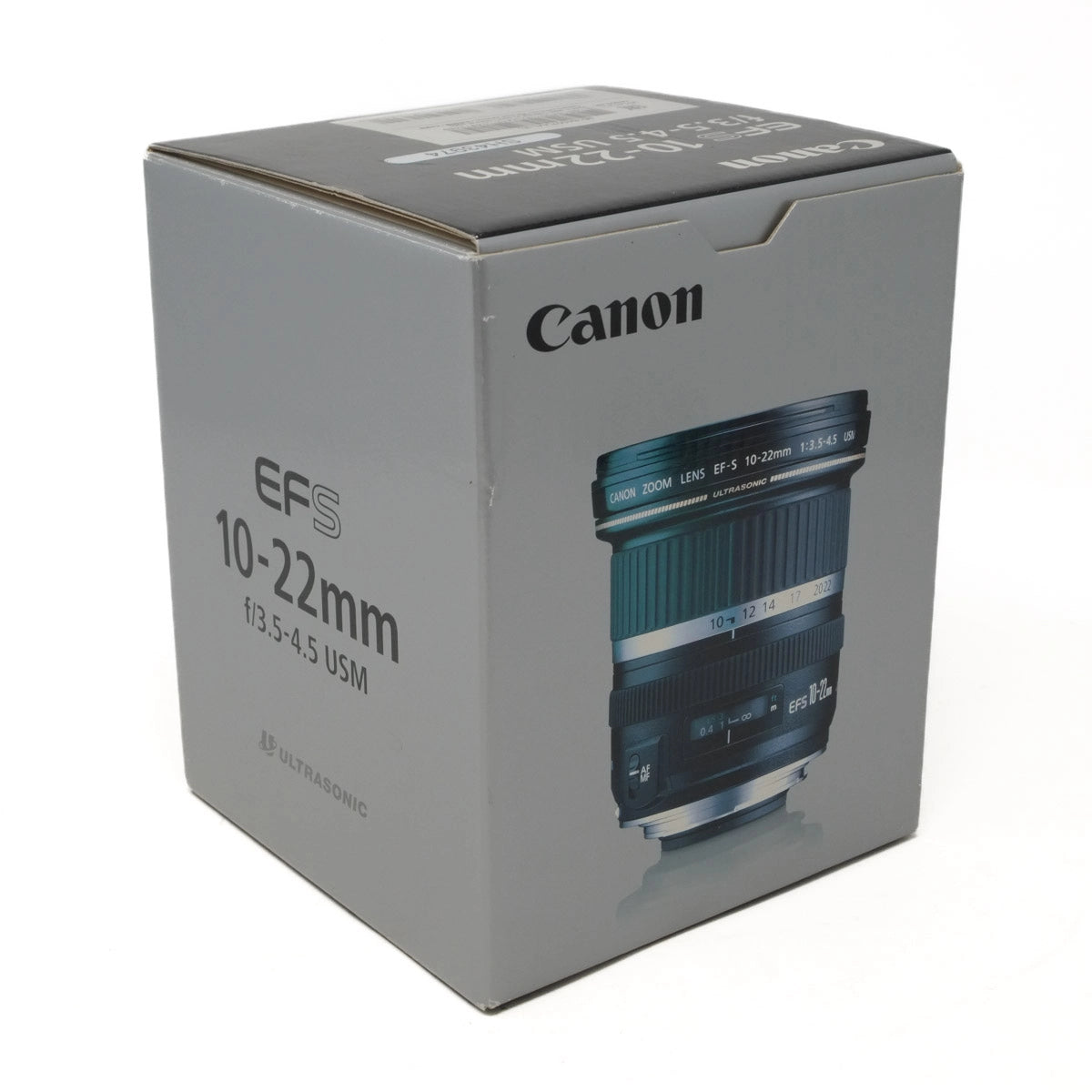 Canon camera lens packaging box with lens illustration on a white background