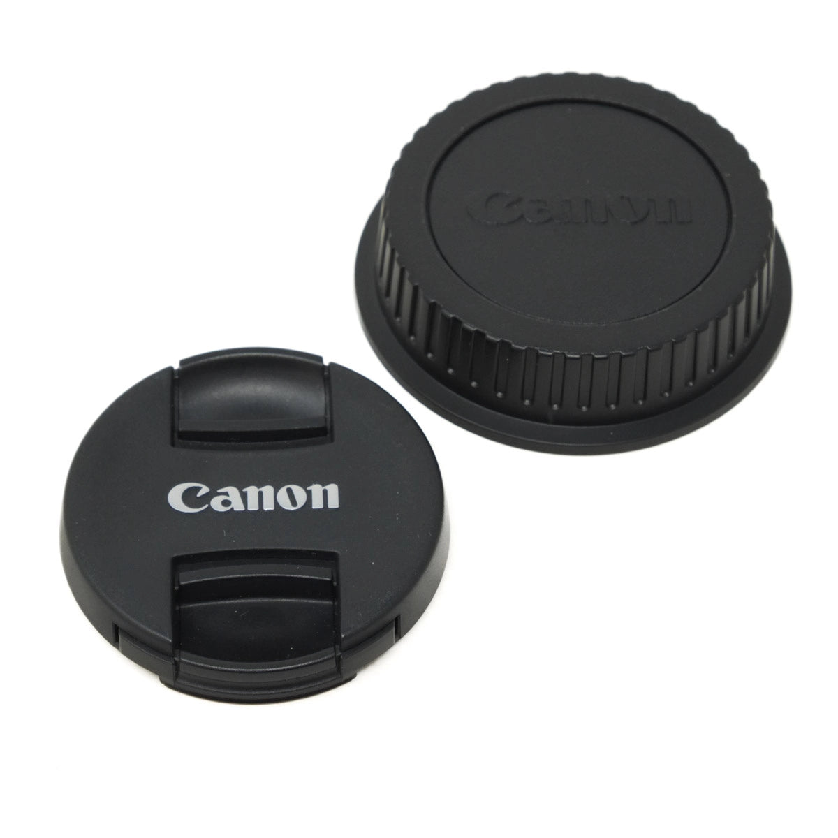 Canon lens cap and body cap on a white background