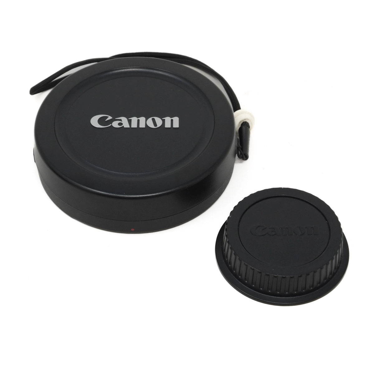 Canon camera lens caps on a white background