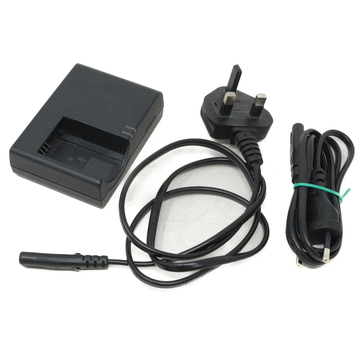 Black battery charger with plug and cable on a white background