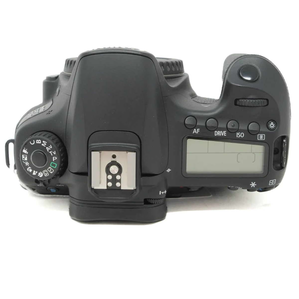 The top view of a black DSLR camera body with a hot shoe, mode dial, and LCD screen on a white background.