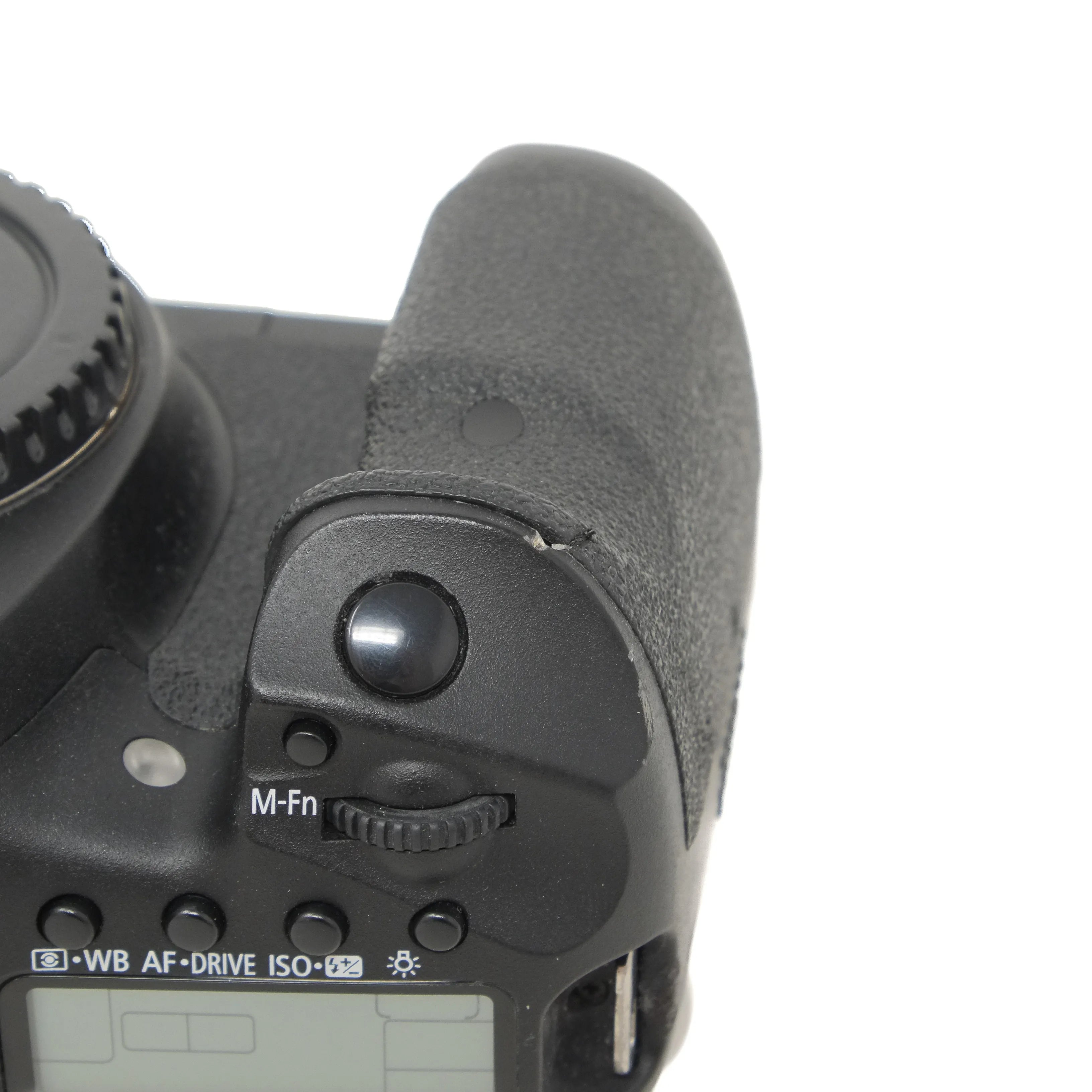 Close-up of a camera body with control buttons on a white background