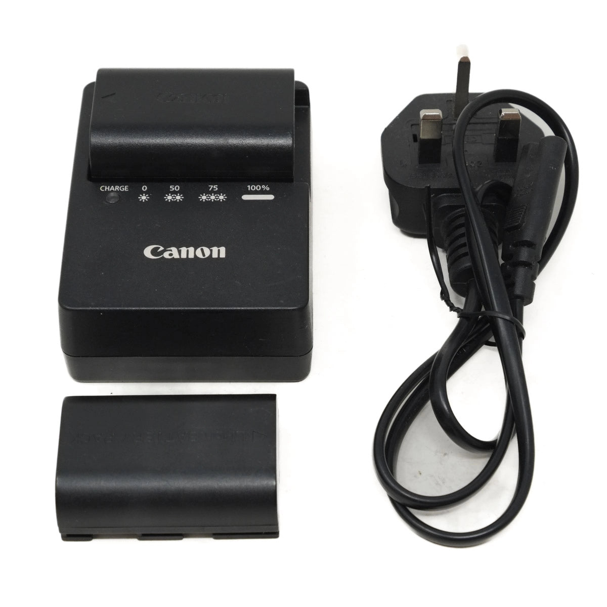 Canon battery charger with battery and plug on a white background