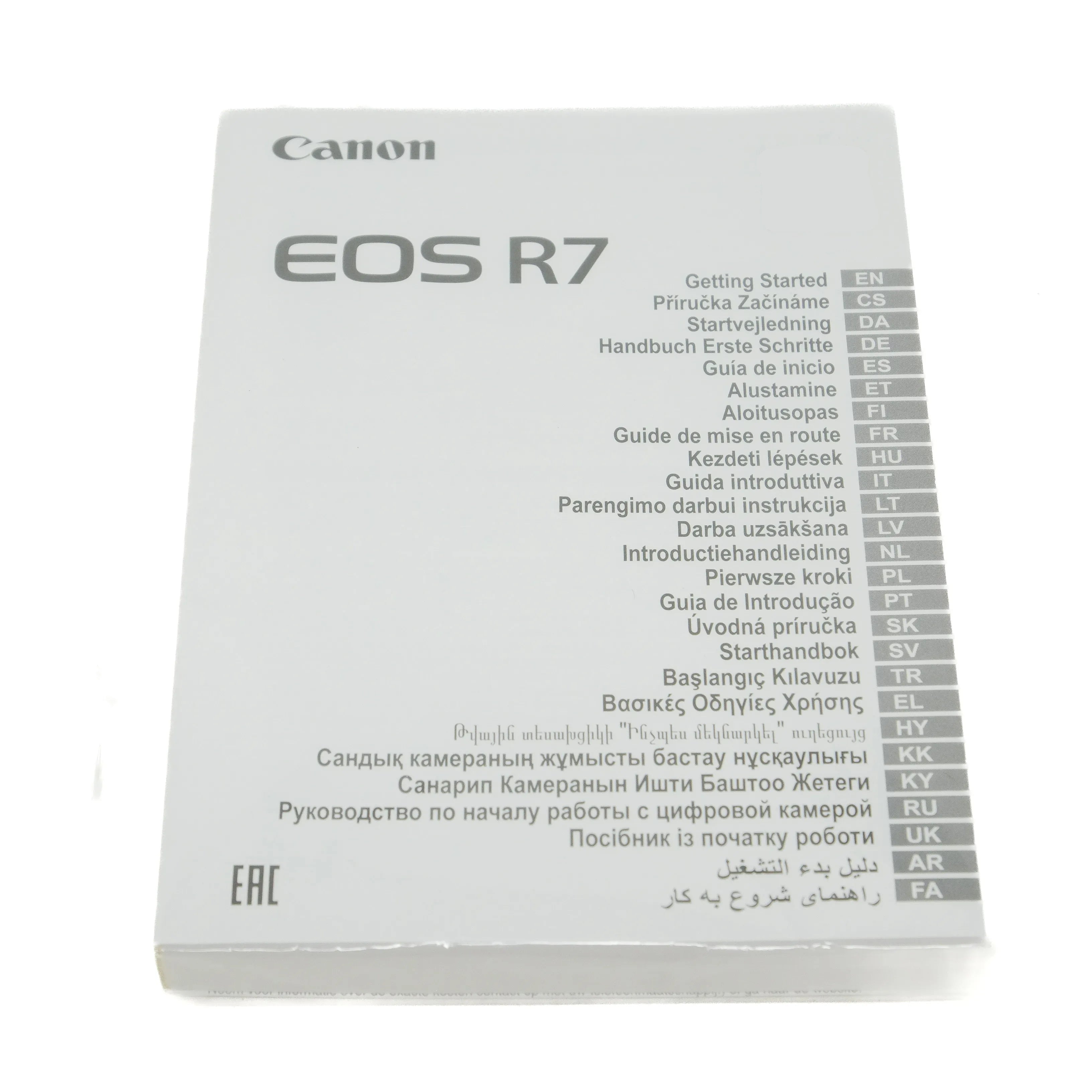 Canon EOS R7 camera manual on a white background