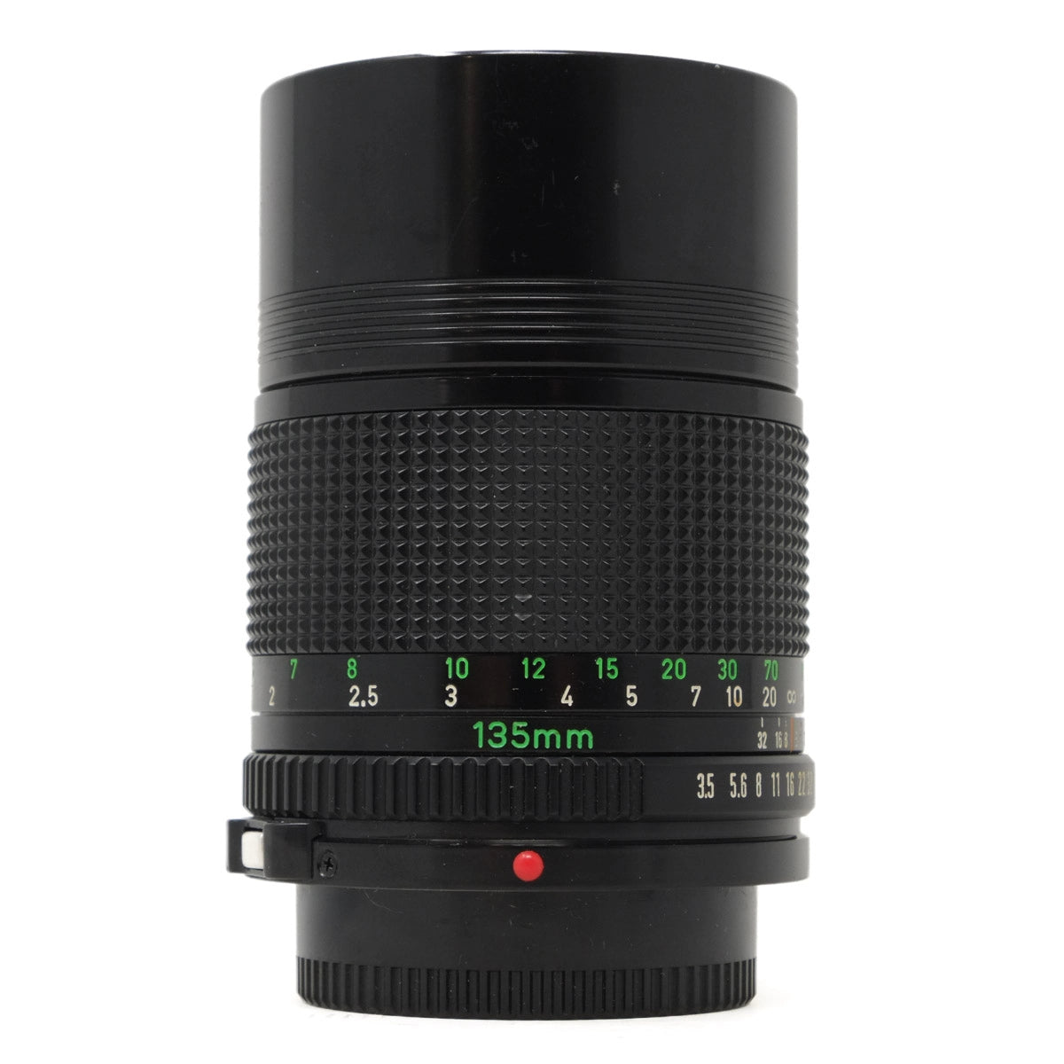 Black camera lens with focus scale on a white background