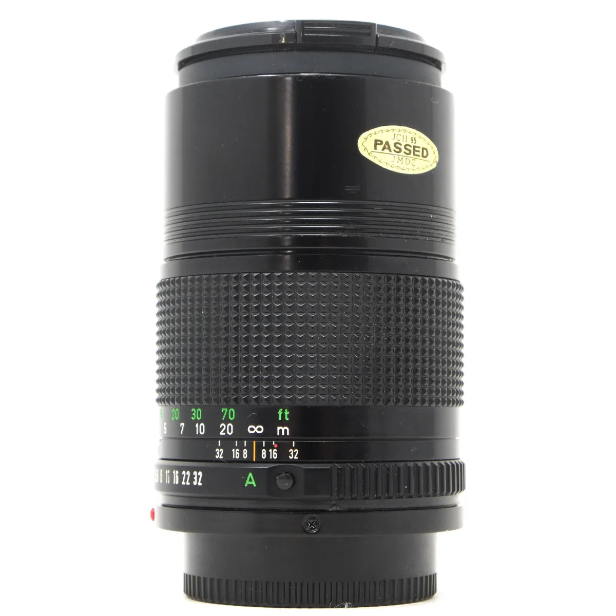 Used Canon FD 135mm F3.5 film camera lens - side angle 
