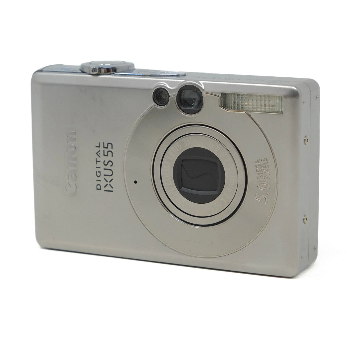 Silver digital camera with 'Canon' branding on a white background