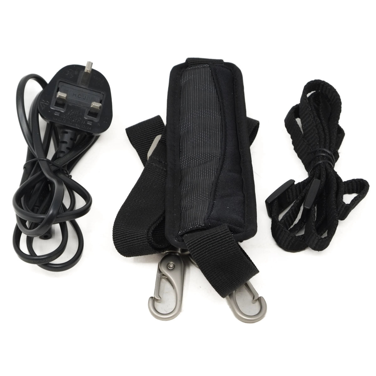 Black strap with carabiners and a power cord on a white background