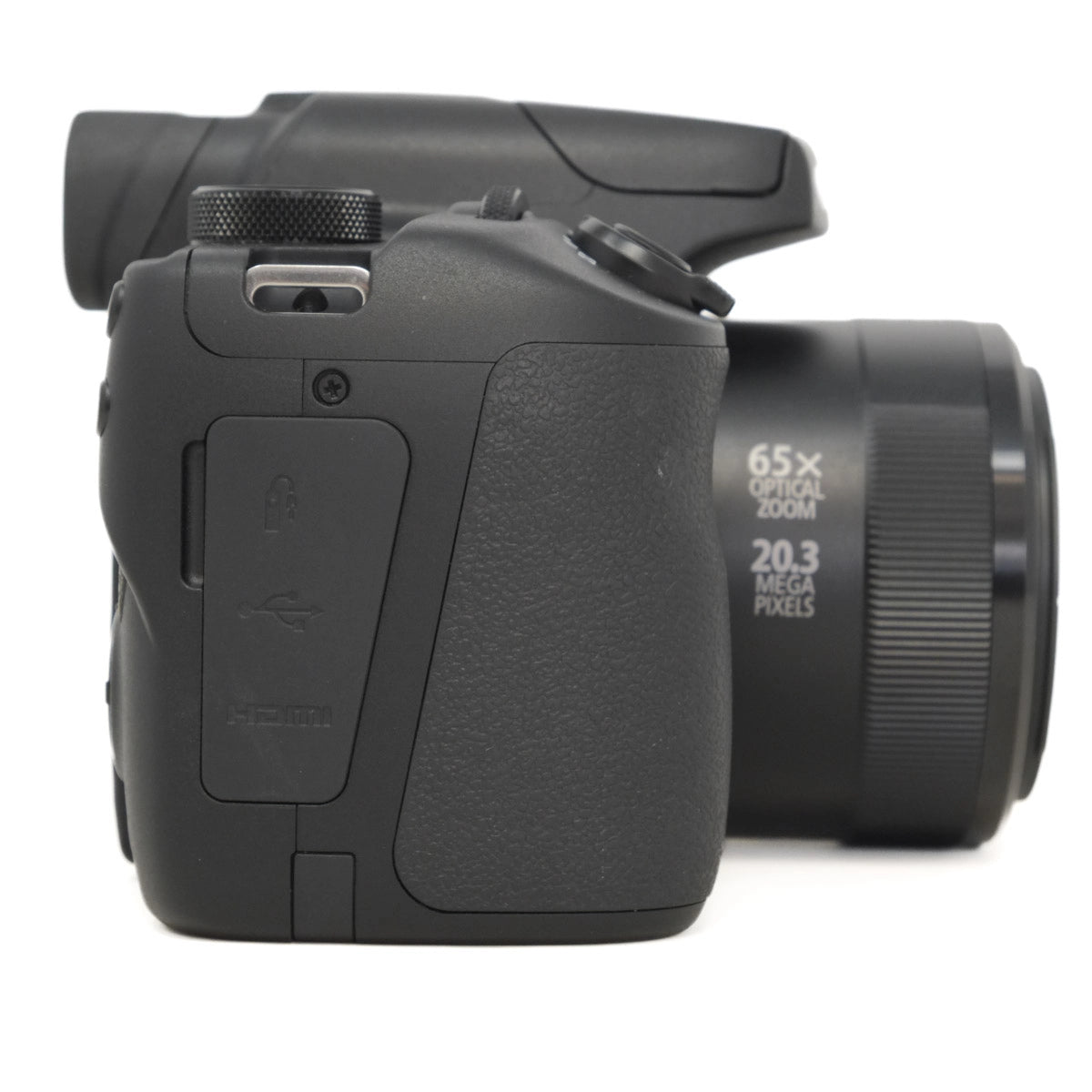 Black digital camera with lens on a white background