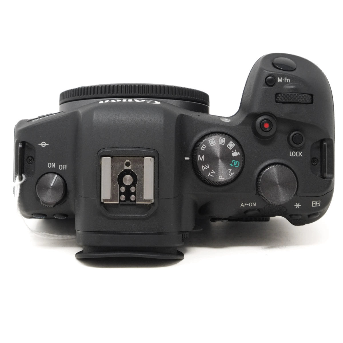 Top view of a black camera body on a white background