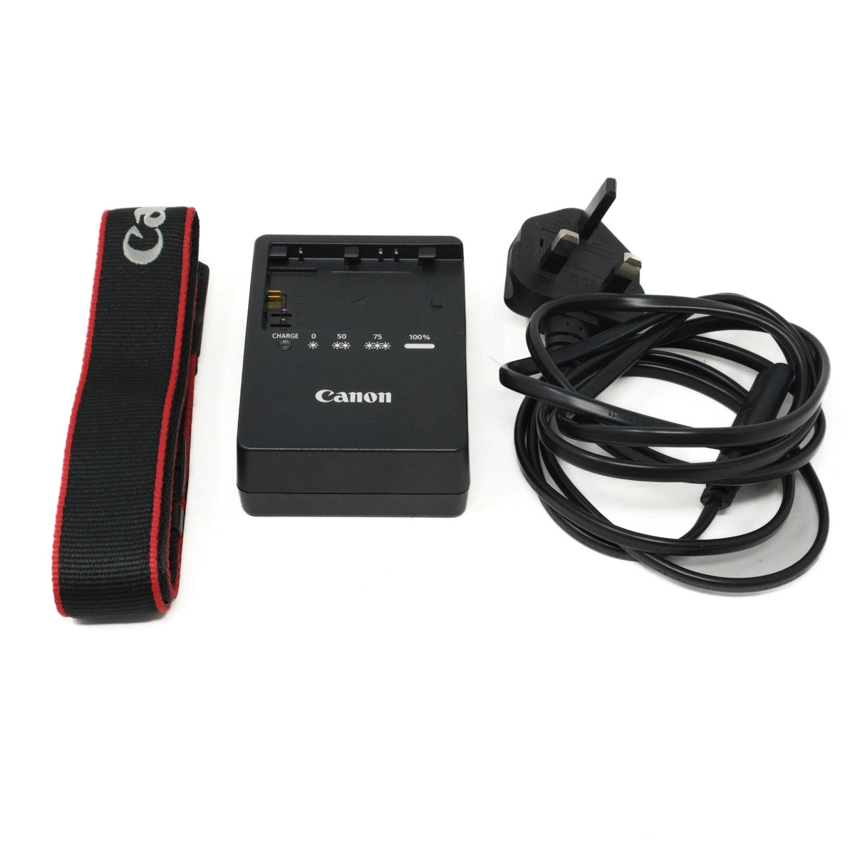 Canon camera charger, power cord, and strap on a white background