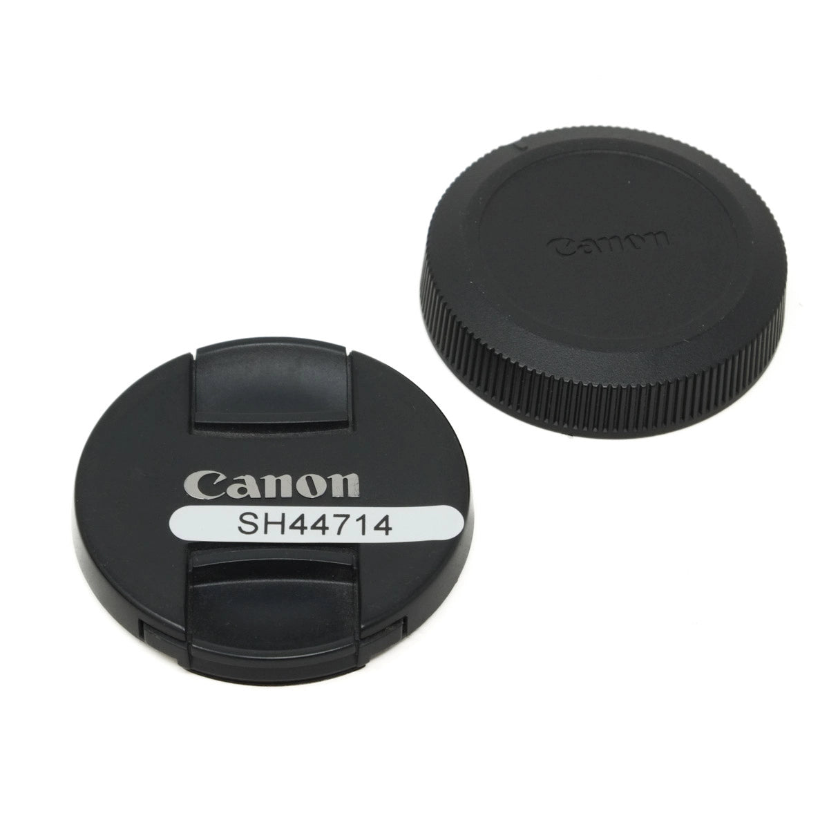 Canon lens cap and body cap on a white background