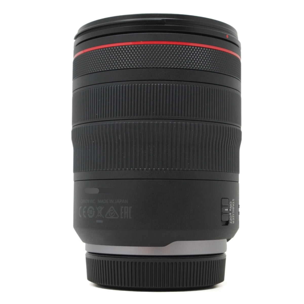 Camera lens with red accent on a white background