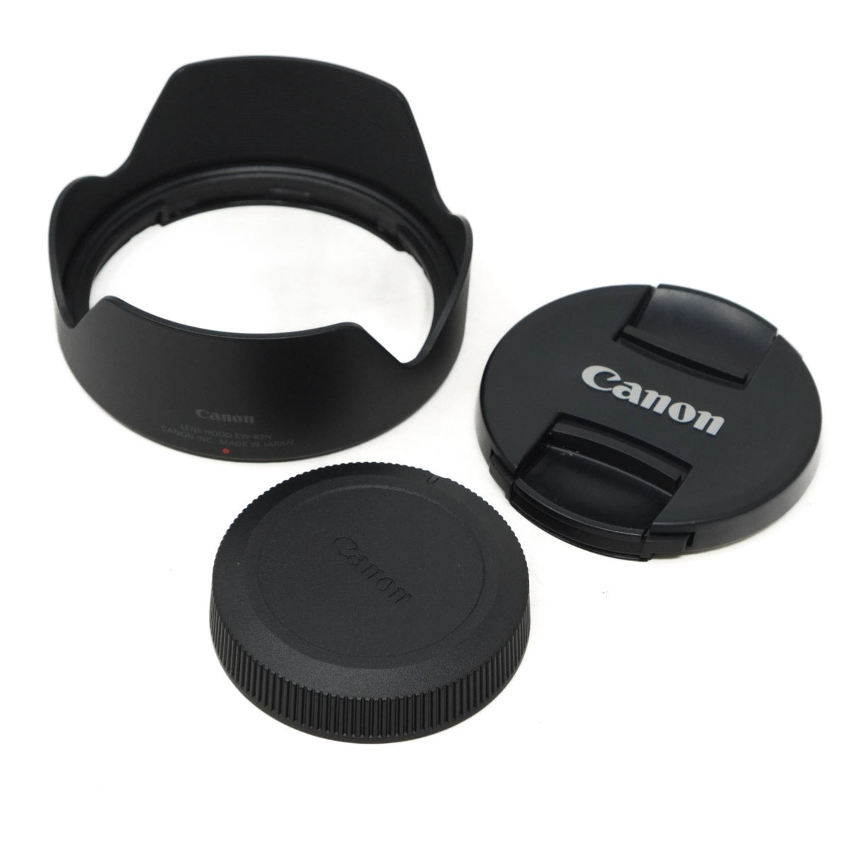 Canon lens caps and lens hood on a white background