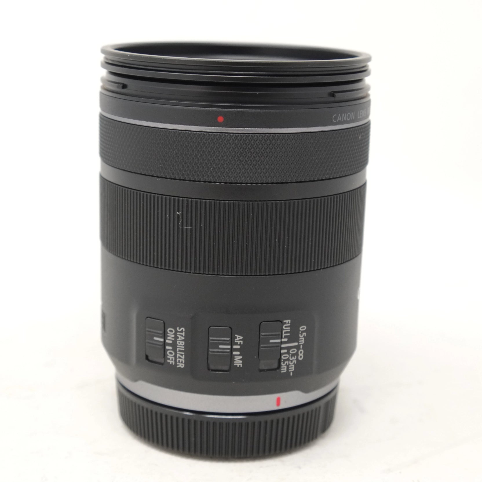 Used Canon RF 85mm f/2 Macro IS STM Lens - side angle 