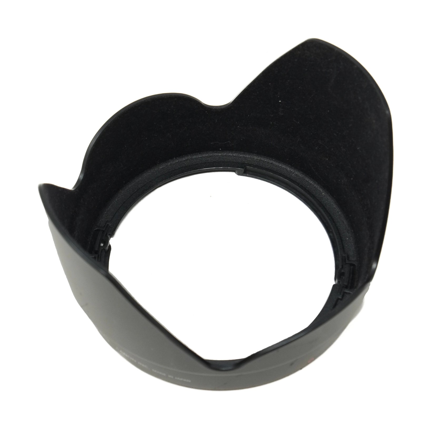 Black camera lens hood on a white background