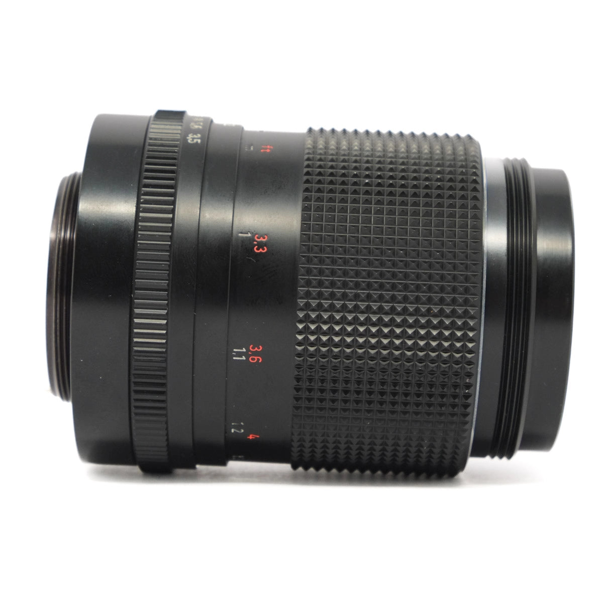 Camera lens with focus scale on a white background