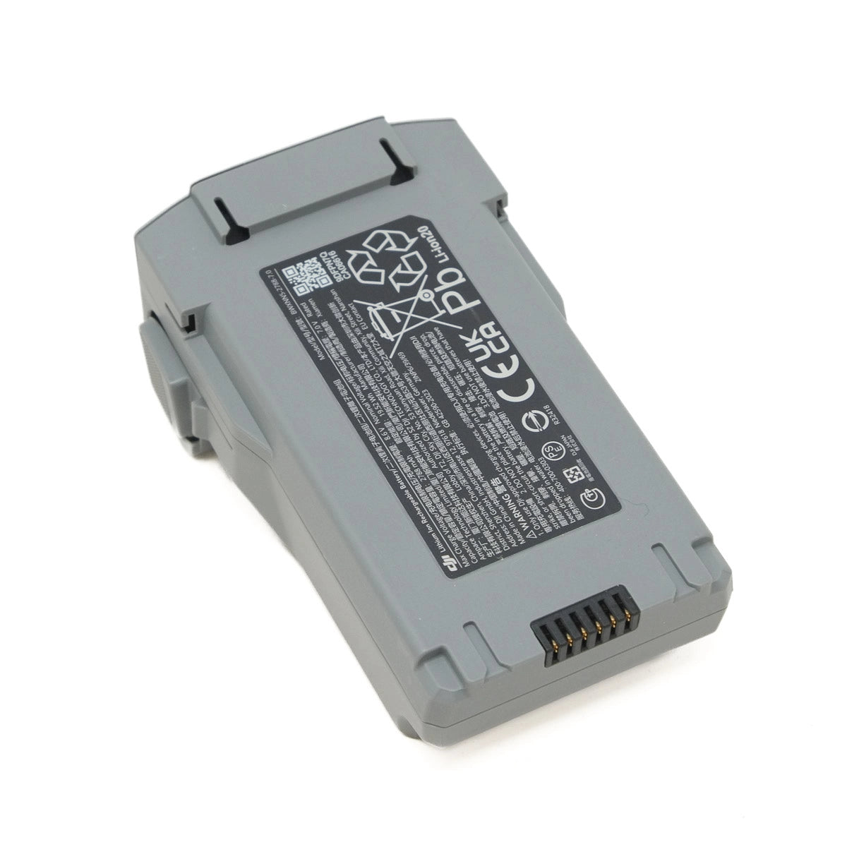 Gray battery with warning labels on a white background