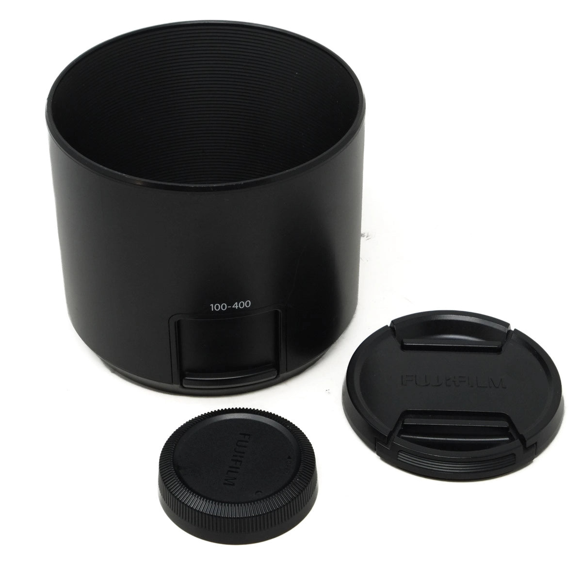 Black camera lens hood with lens covers on a white background