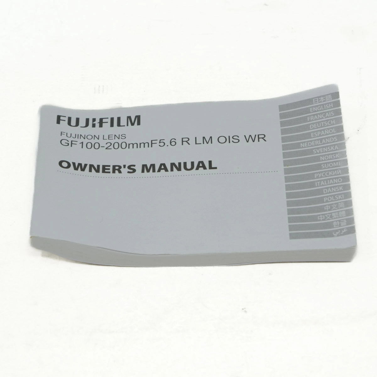 FujiFilm lens owner's manual on a white background