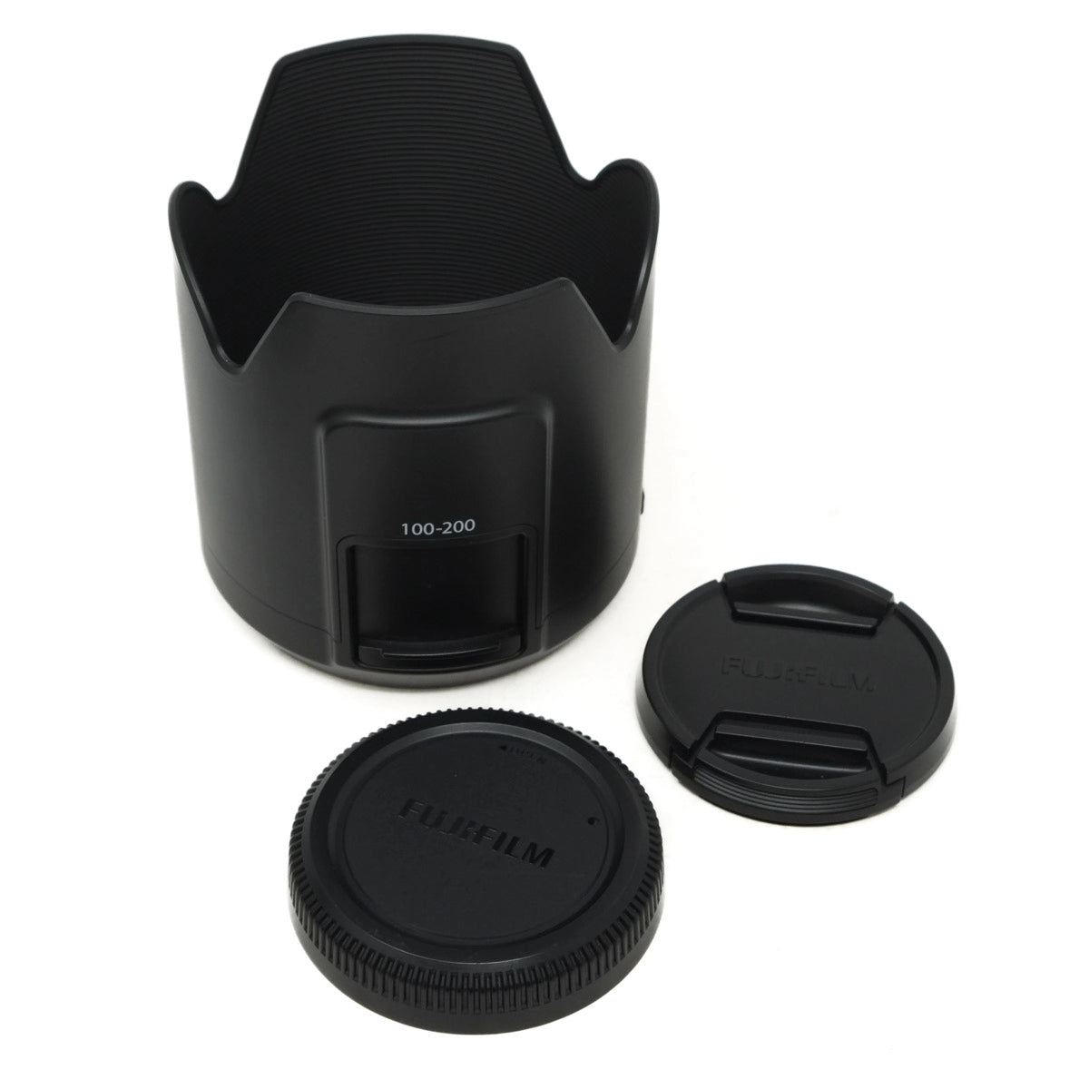 Camera lens hood and caps on a white background