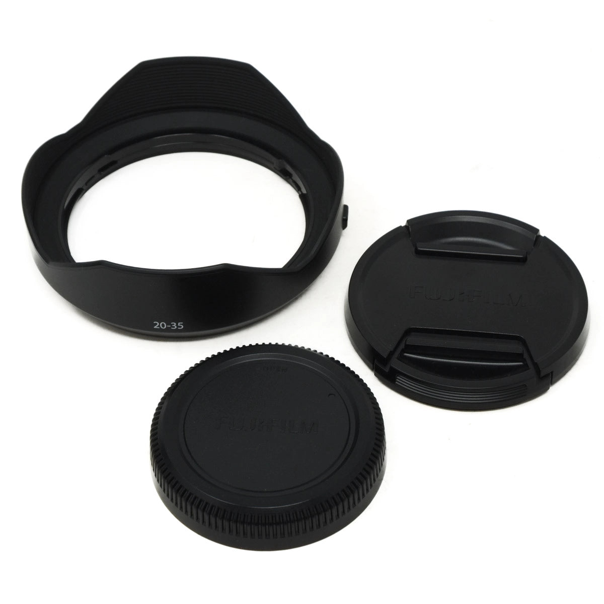 Camera lens hood, front cap, and rear cap on a white background