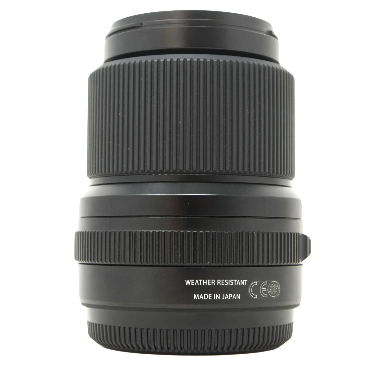A black weather-resistant camera lens with ribbed focus and aperture rings, featuring white text that reads 'WEATHER RESISTANT' and 'MADE IN JAPAN' on a clean white background.