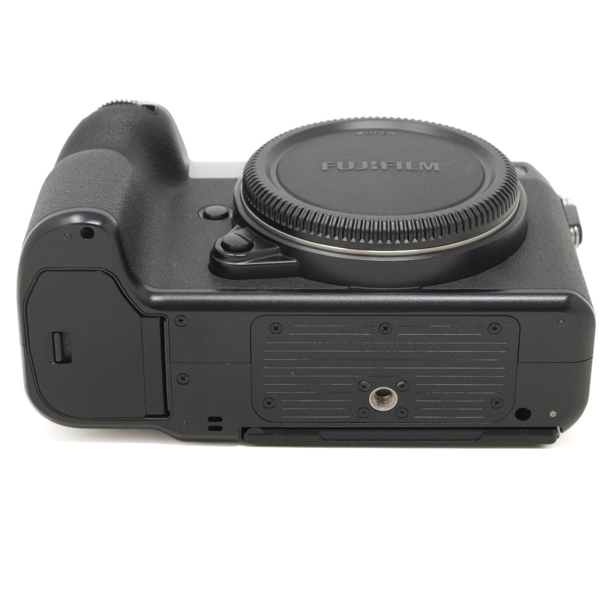 Bottom view of a Fujifilm camera on a white background