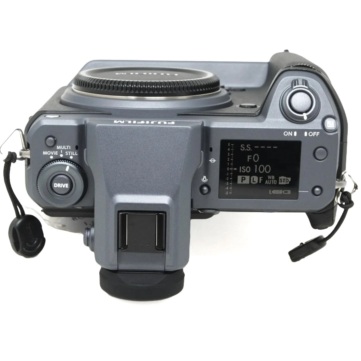 A top-down view of a Fujifilm mirrorless camera body in dark gray, showing the rear dial, screen, hot shoe, and control buttons against a white background.