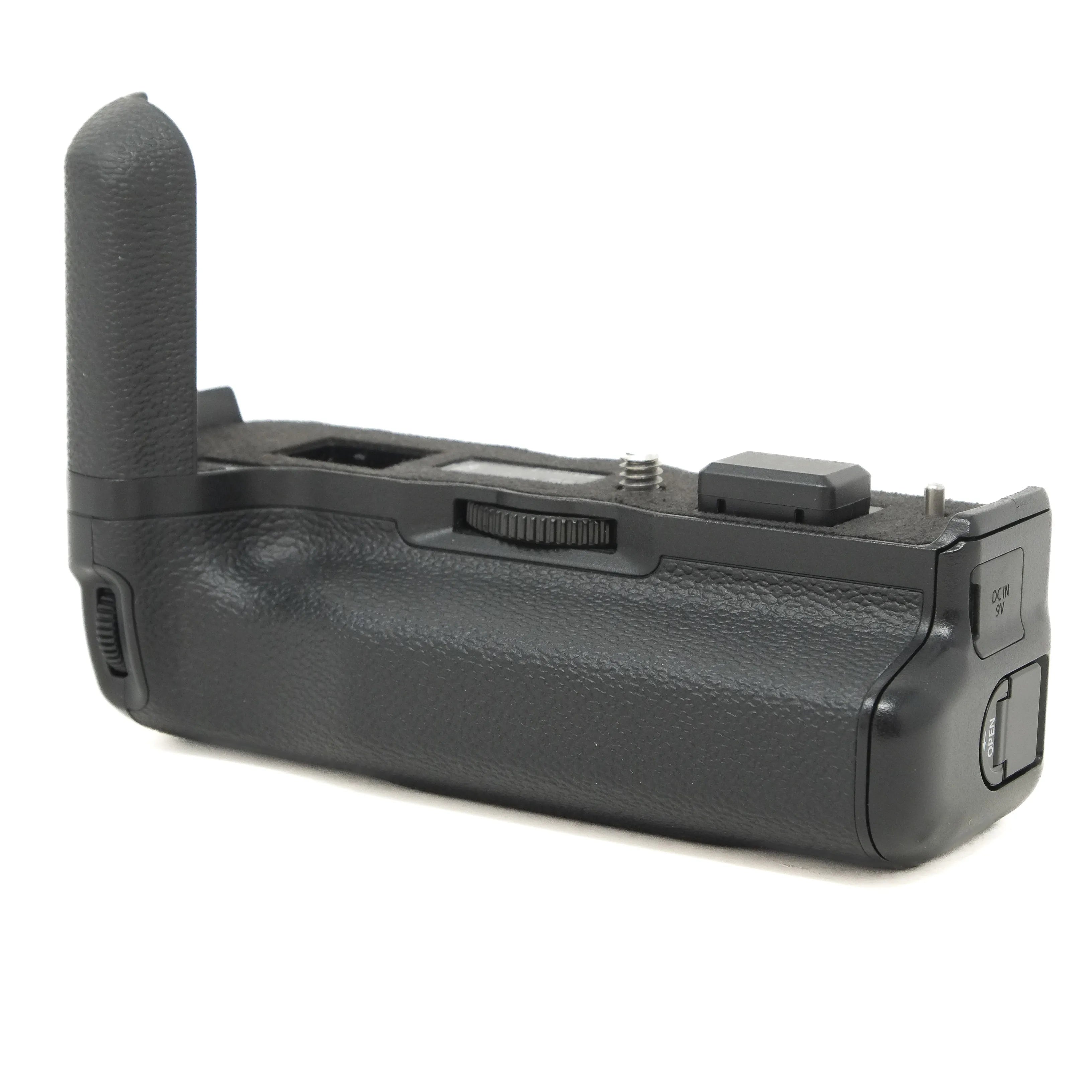 Black camera battery grip on a white background