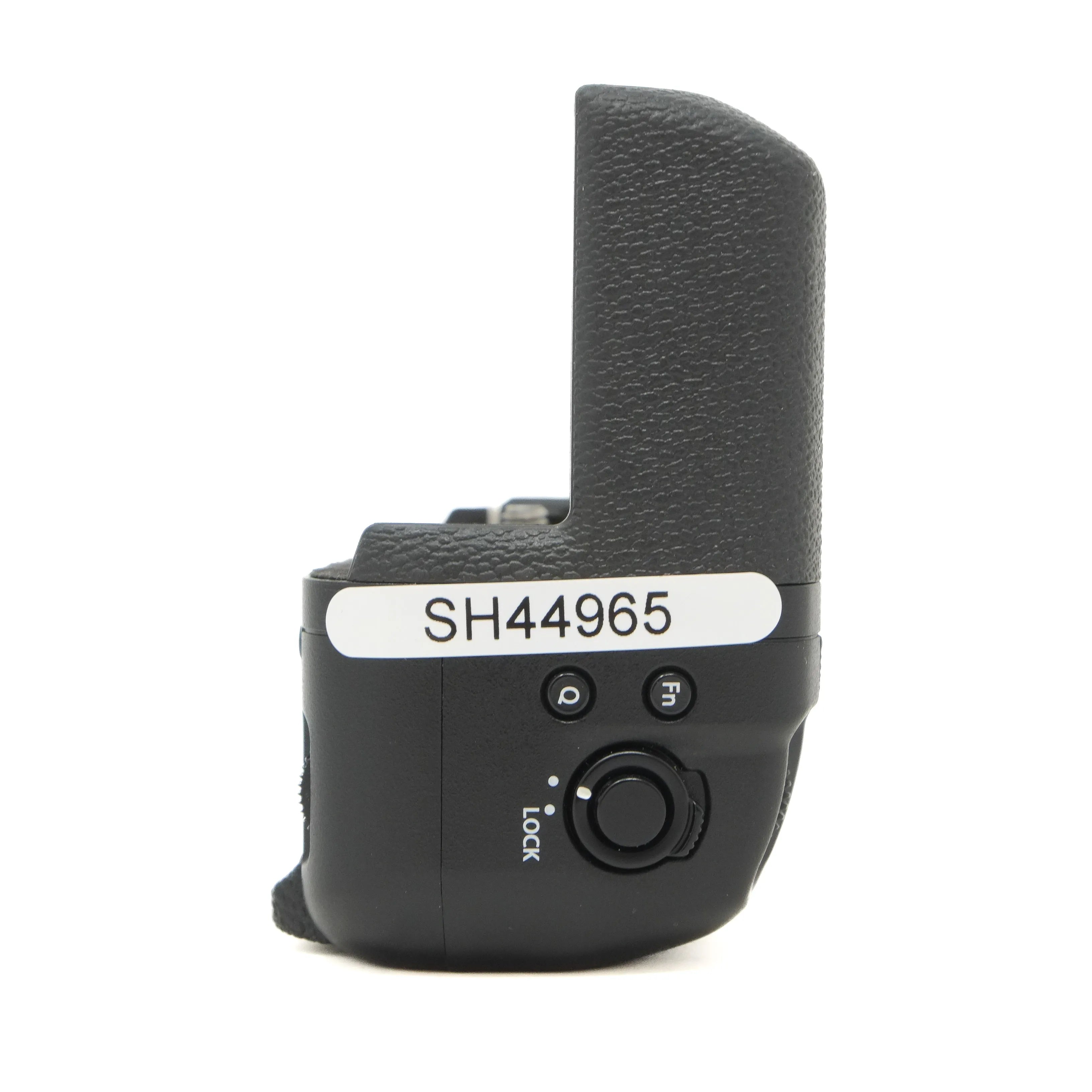 Black camera grip with control buttons and a label on a white background