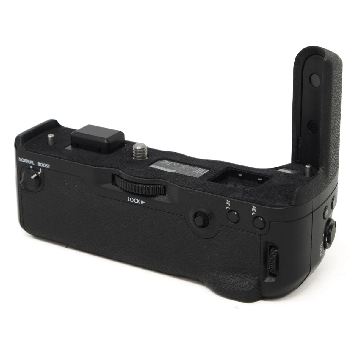 Black camera battery grip on a white background