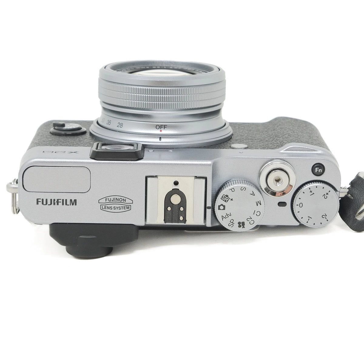Dark silver Fujifilm camera on a white background