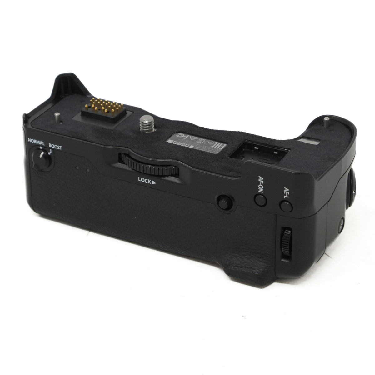 Black camera battery grip on a white background