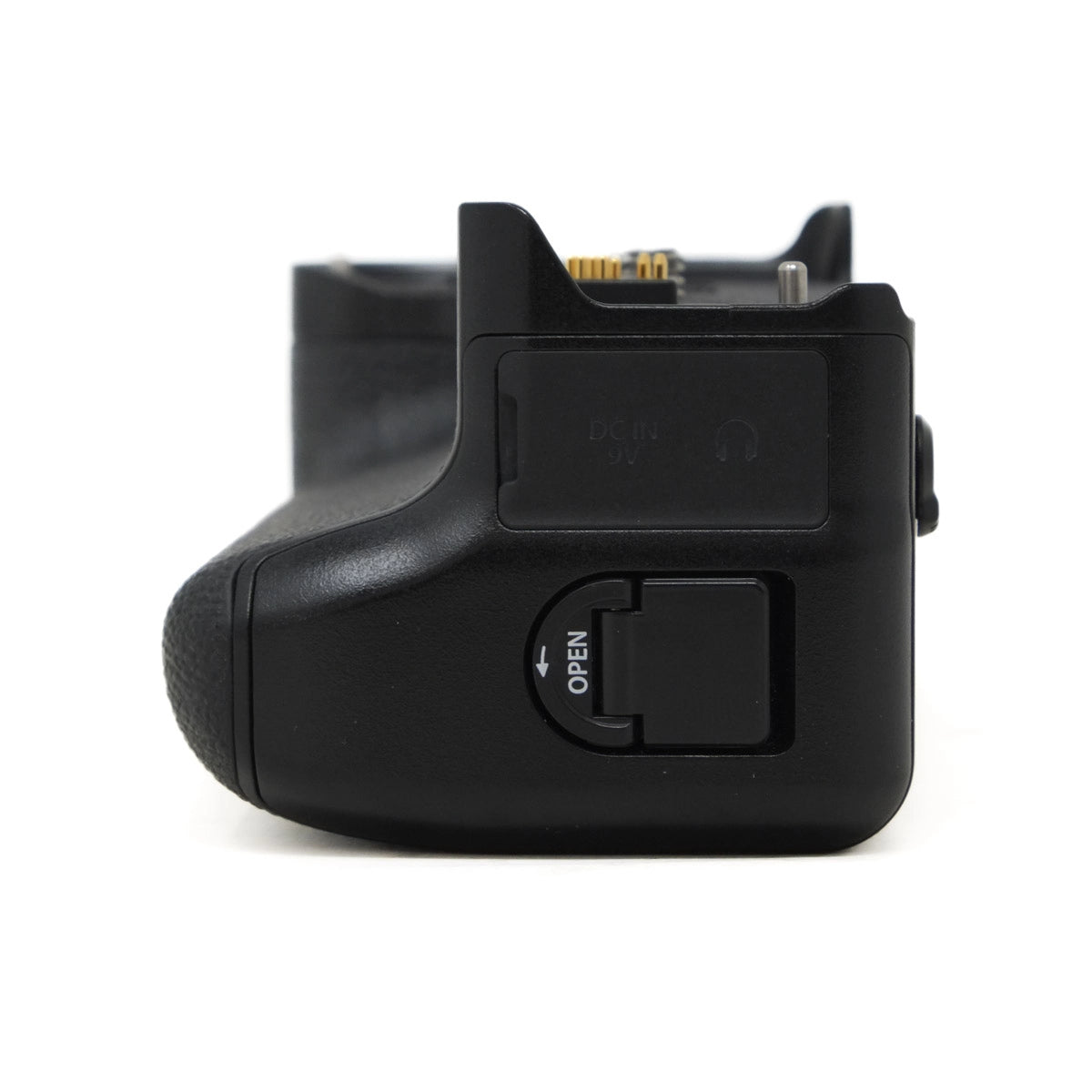 Black camera battery grip on a white background