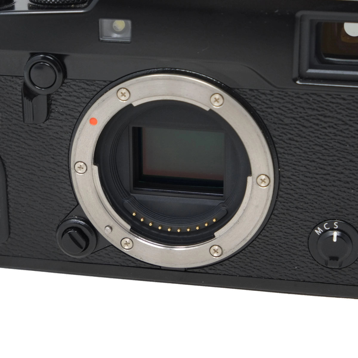 Close-up of a camera body with a lens mount on a white background