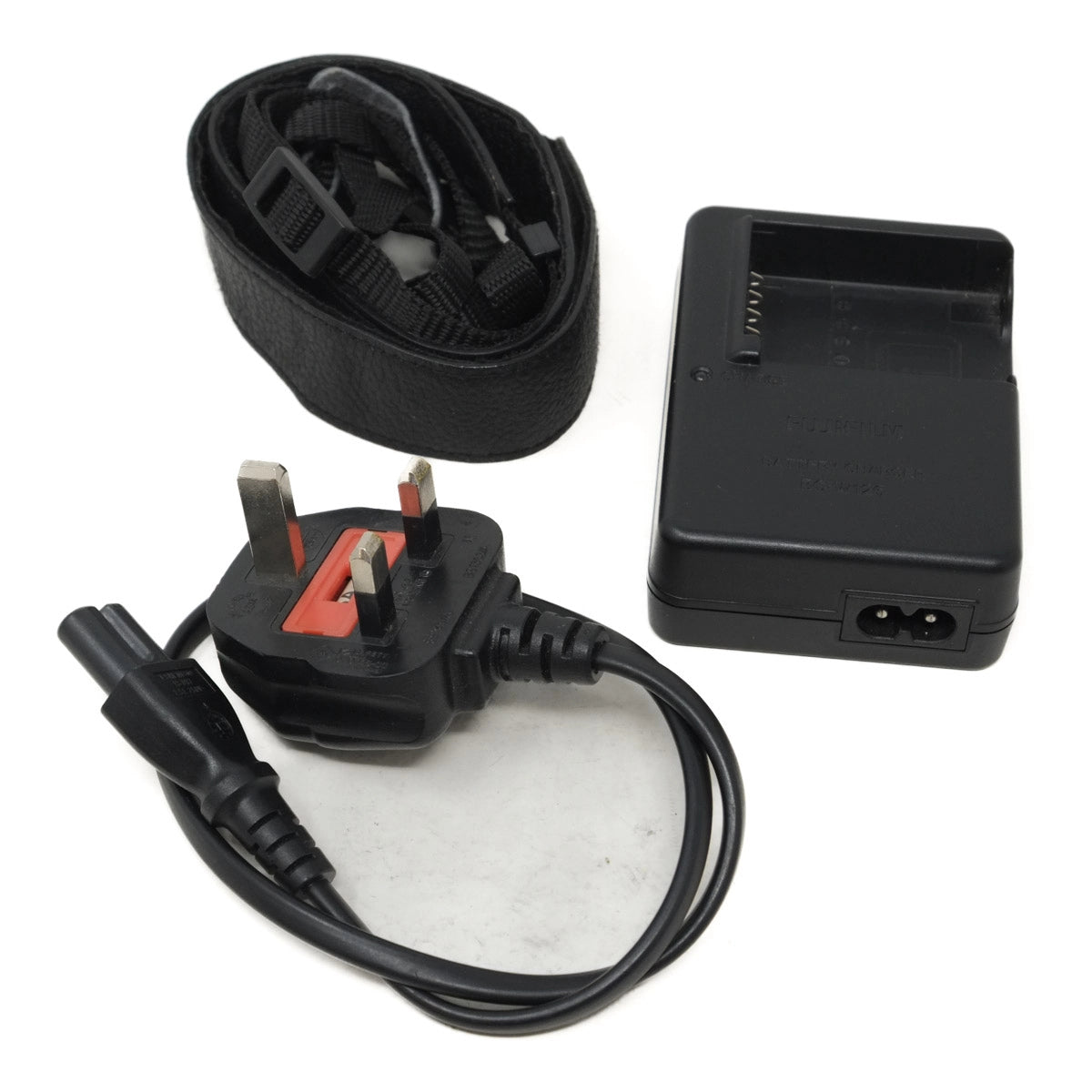 Black strap, black cable, and black battery charger on a white background