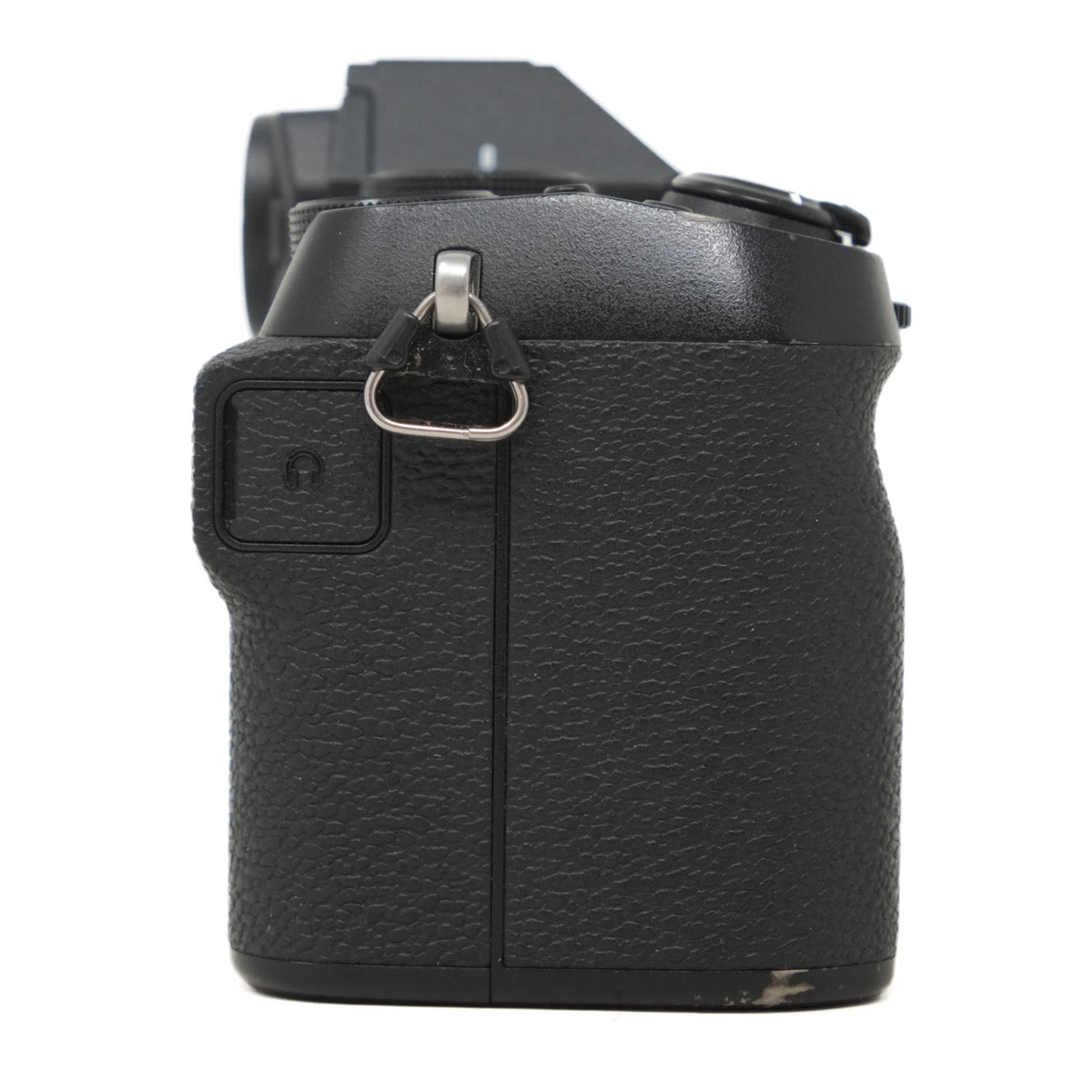 Black camera body with textured finish on a white background