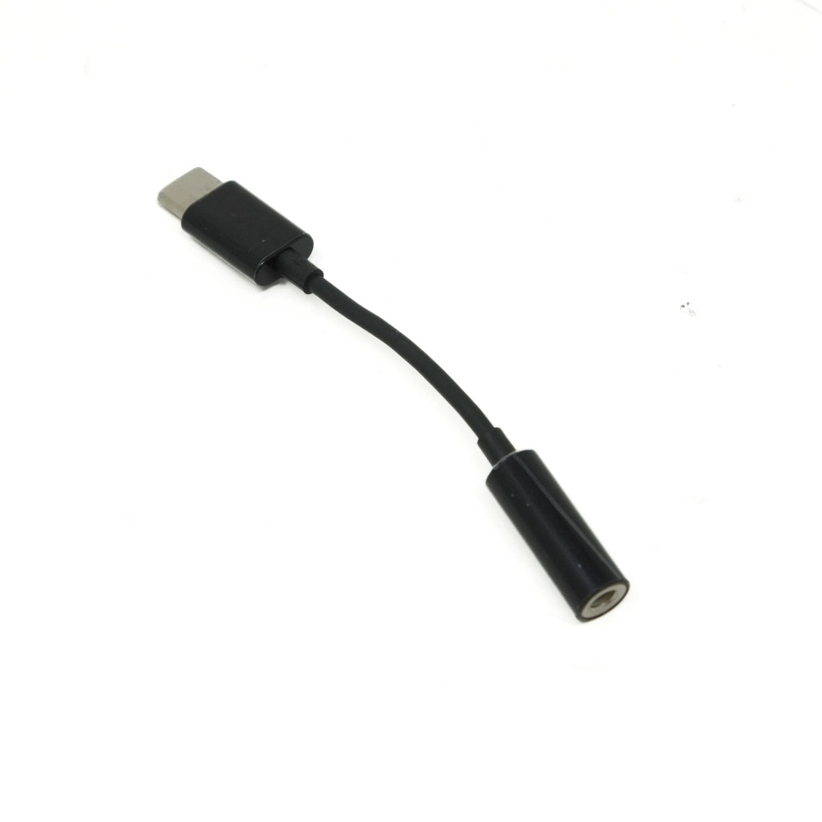 Black USB-C to headphone adapter on a white background