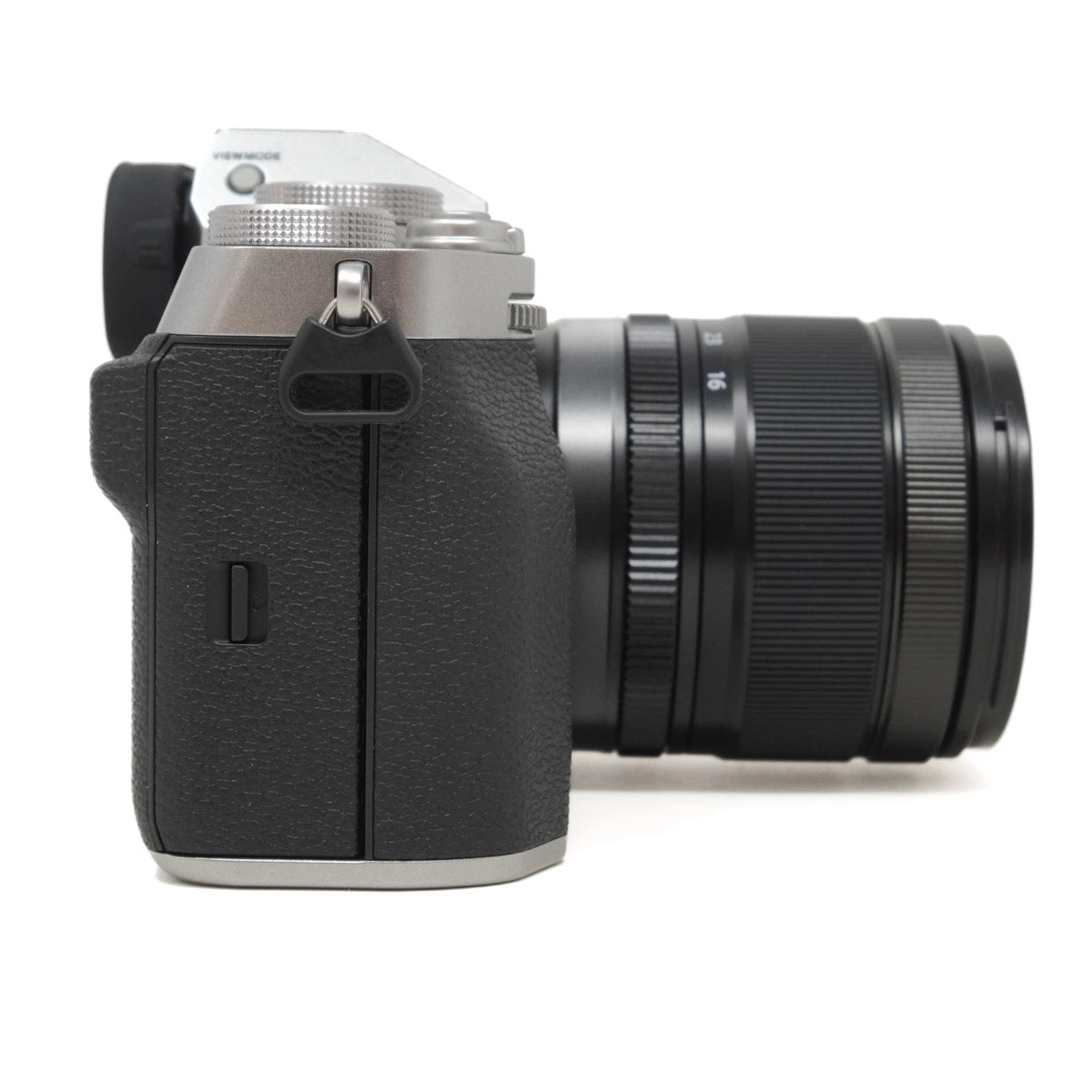Black camera with lens on a white background