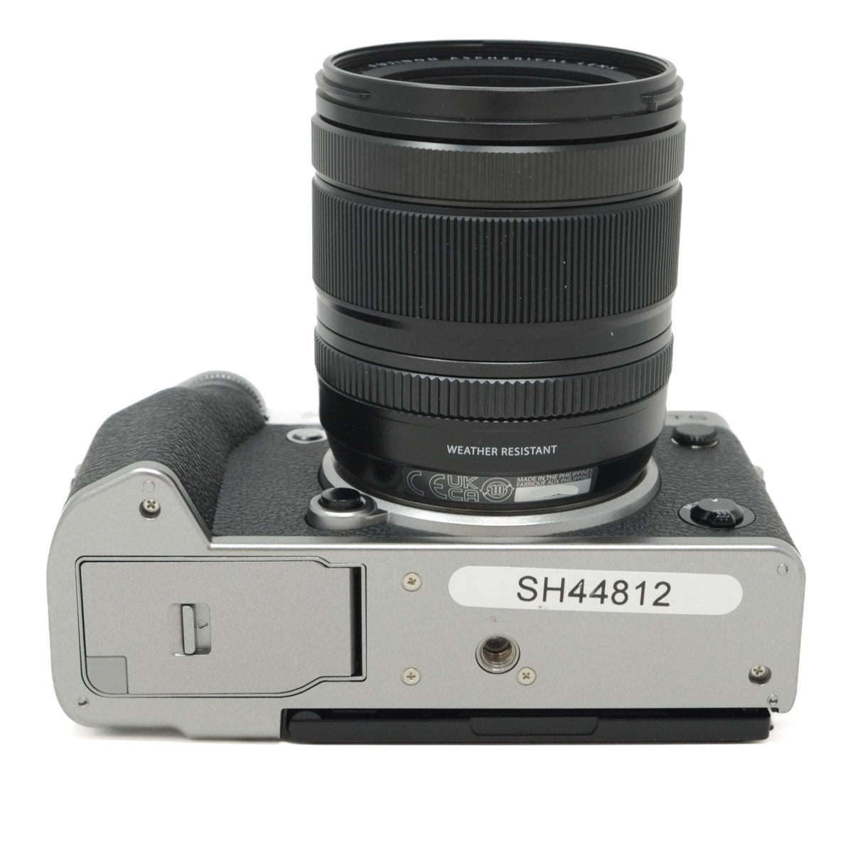 Camera body with lens on a white background