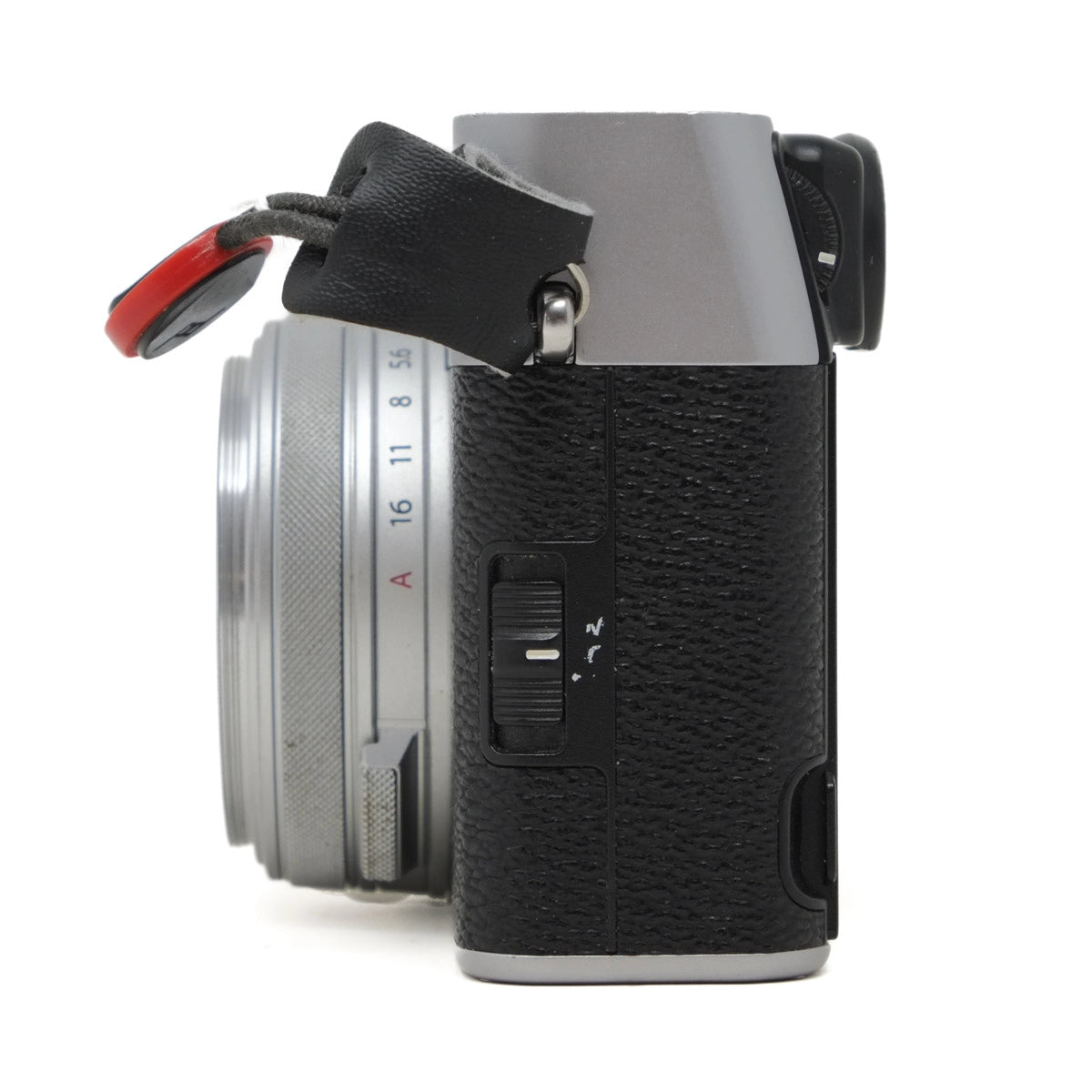 Camera body with lens on a white background