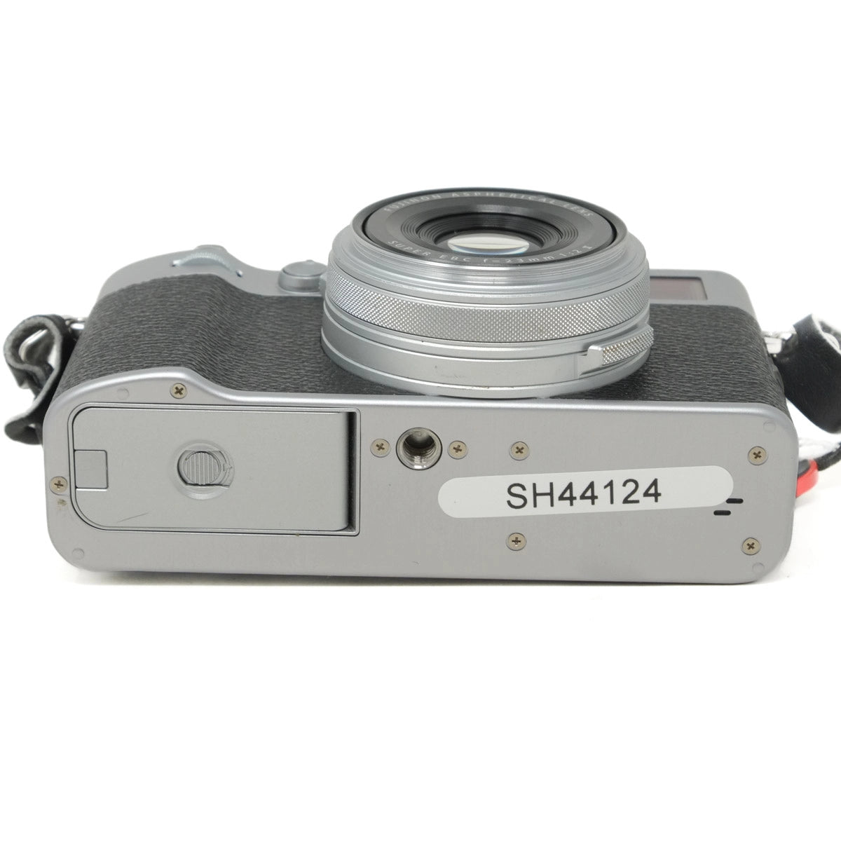 Silver camera with visible model number on a white background