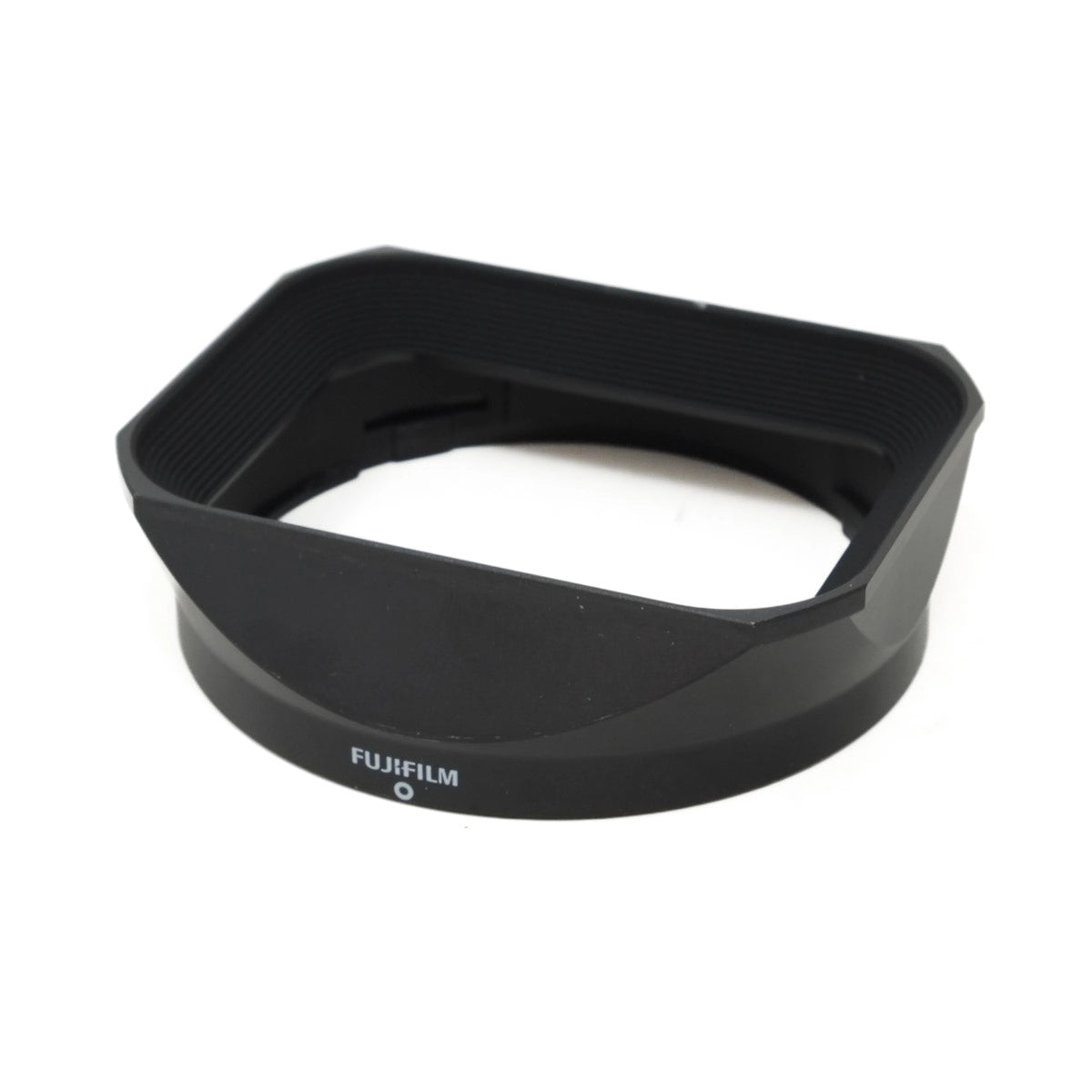 Black Fujifilm lens hood on a white background