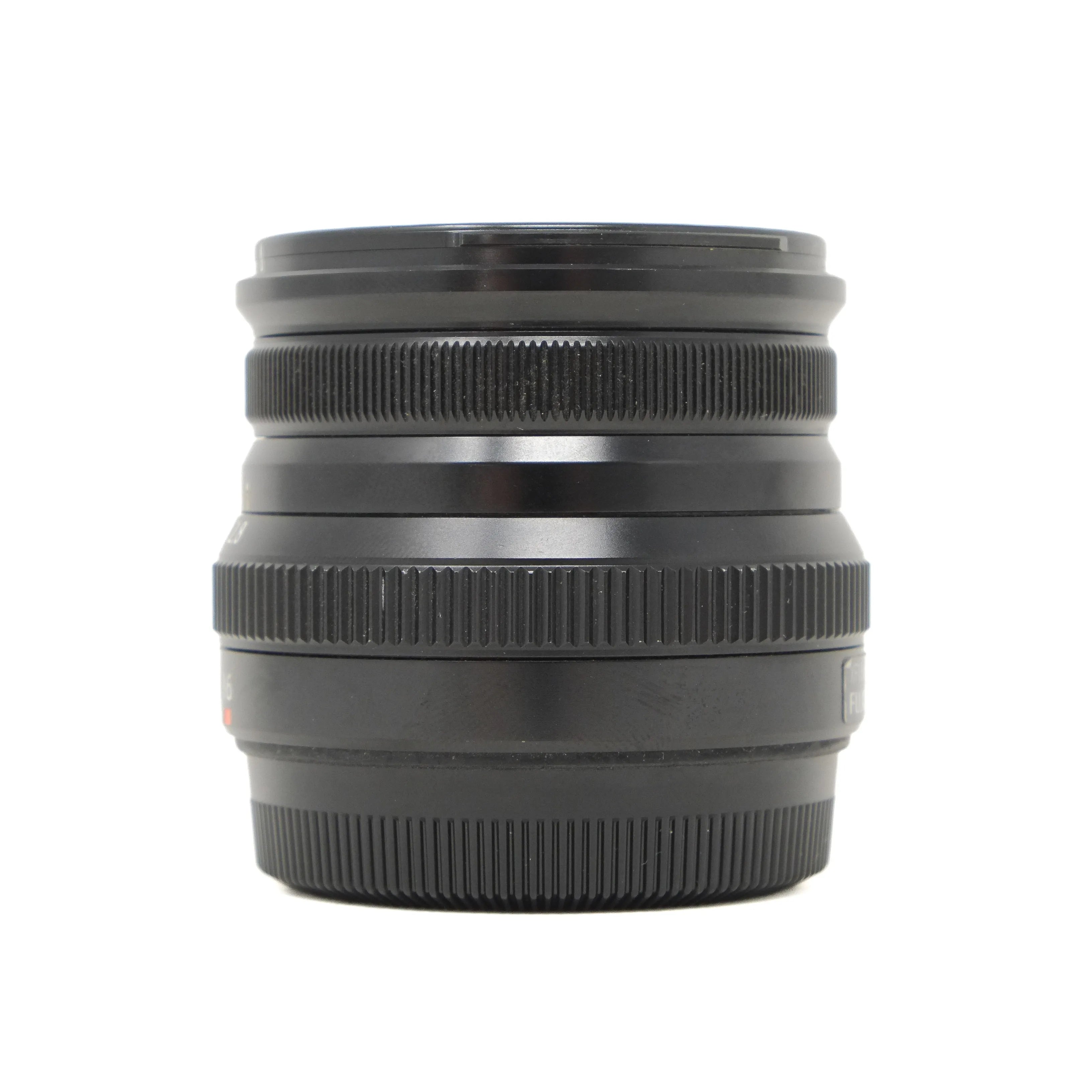 Black camera lens on a white background