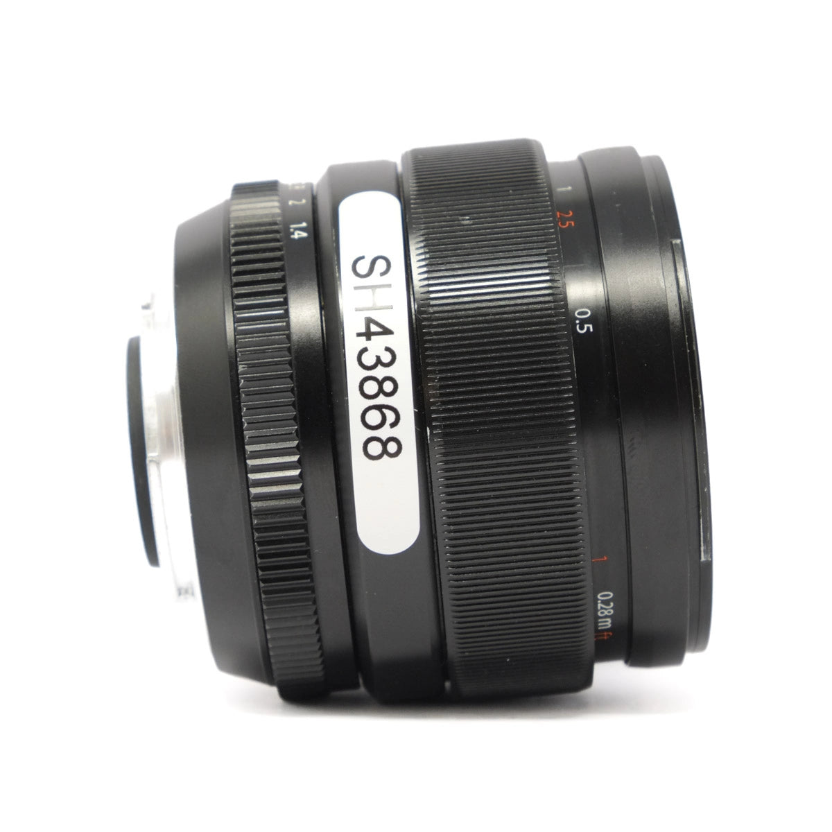 Camera lens with a visible model number on a white background