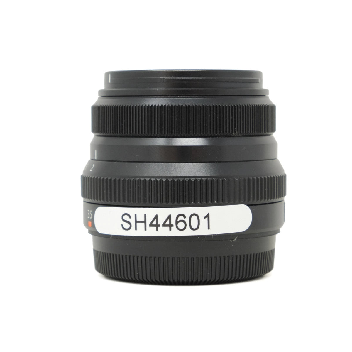 Black camera lens with a visible model number on a white background
