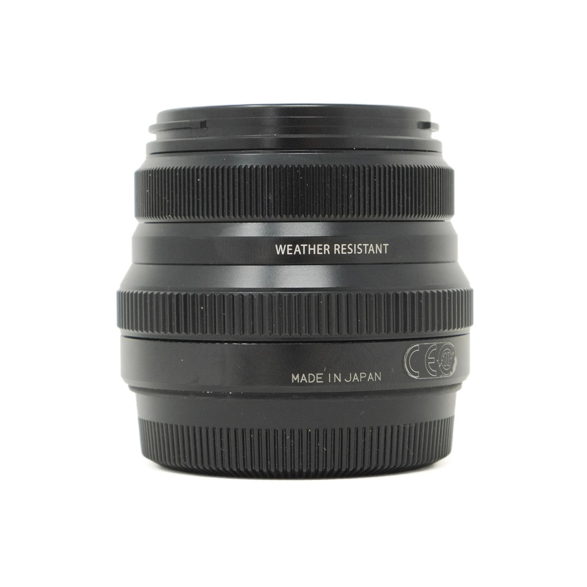 Black camera lens with 'Made in Japan' text on a white background