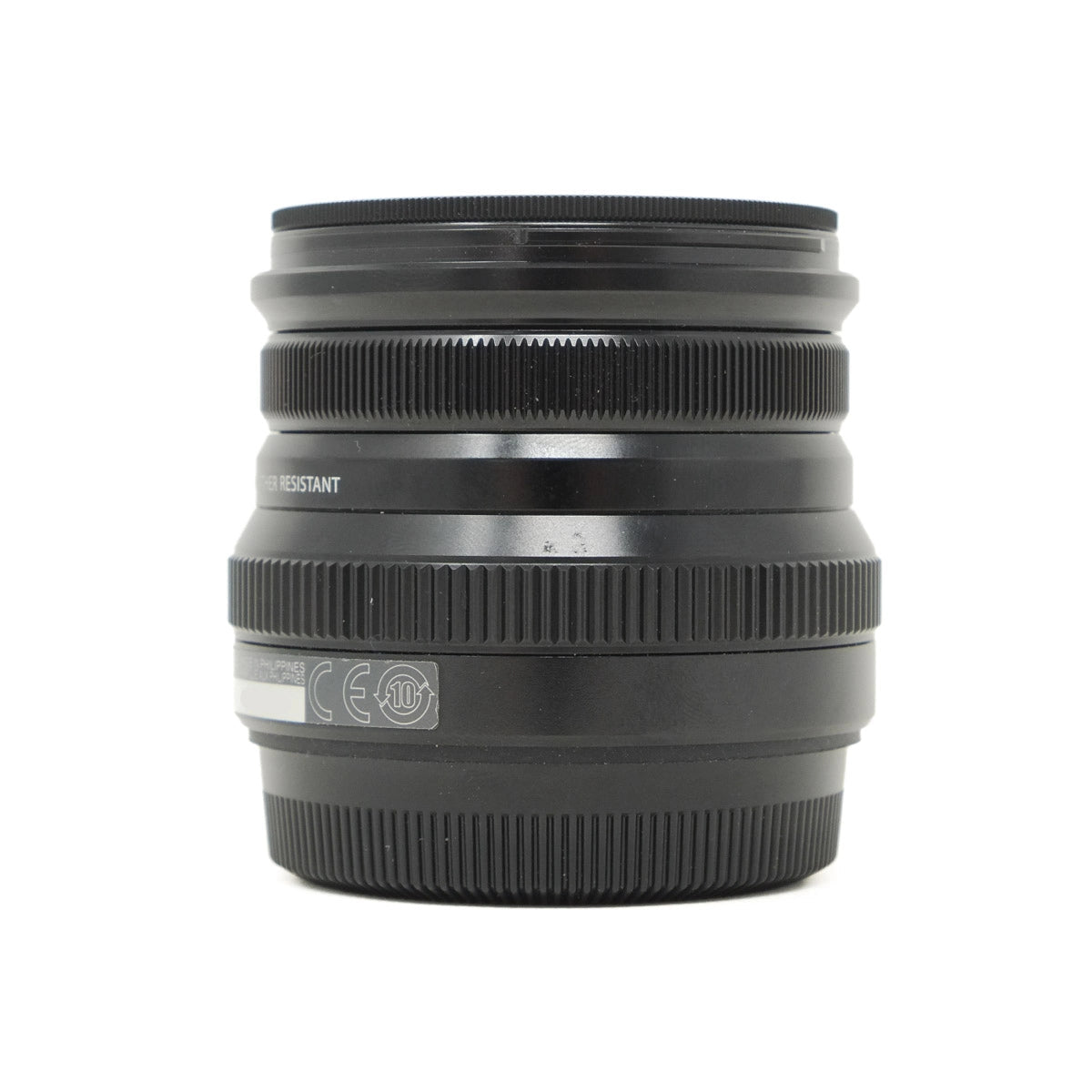 Black camera lens on a white background